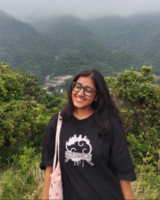 Shreya Chauhan outdoors wearing a dark jacket
